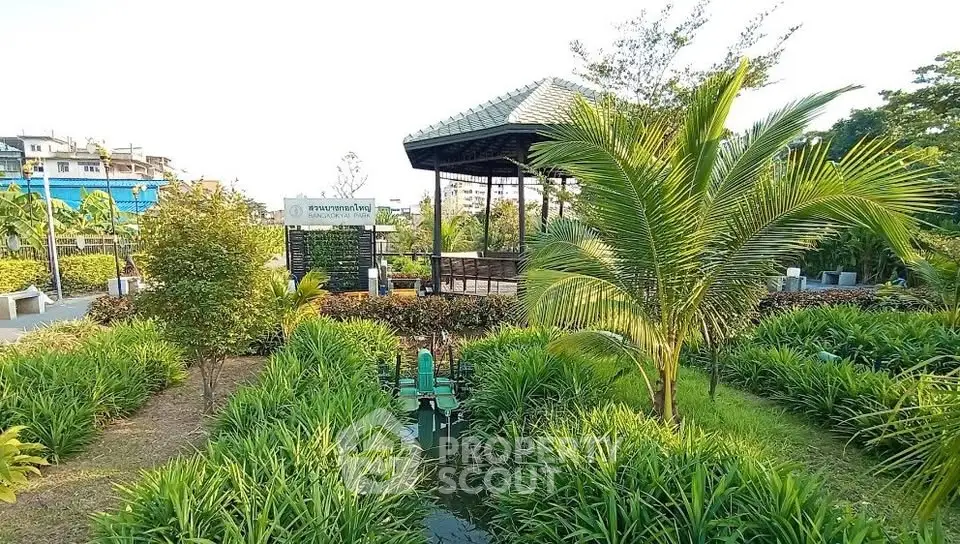 Lush garden with gazebo in serene residential community, perfect for relaxation and outdoor activities.