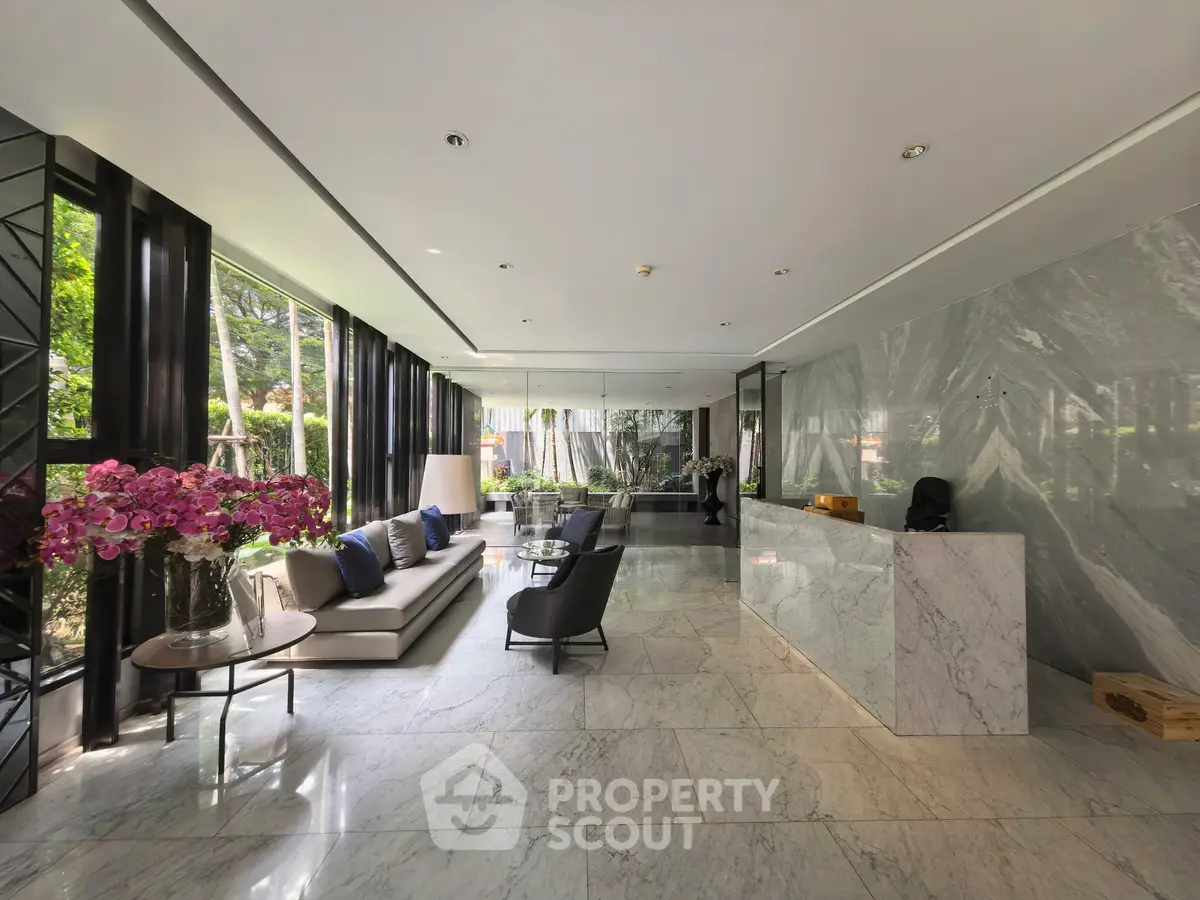 Luxurious modern lobby with marble floors and elegant seating area