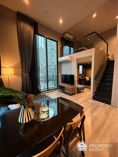 Luxurious modern loft apartment with high ceilings and city view, featuring elegant decor and spacious layout.