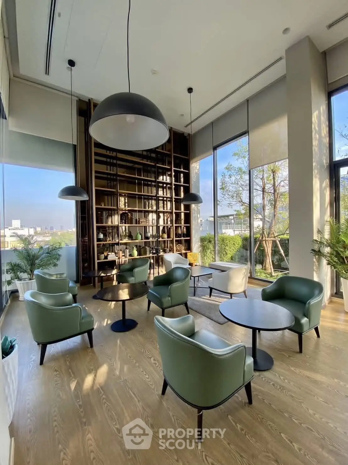 Luxurious modern living room with high ceilings and panoramic windows