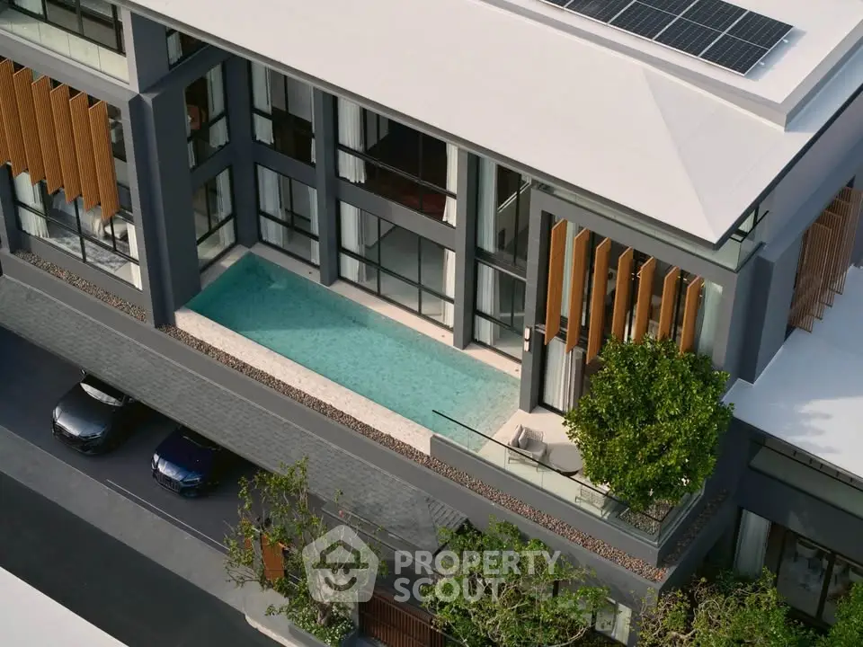 Modern luxury building with private pool and solar panels, showcasing contemporary architecture and eco-friendly design.