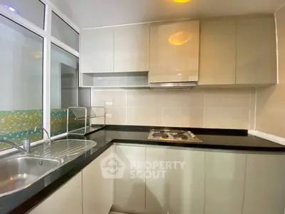 Modern kitchen with sleek cabinets and built-in gas stove
