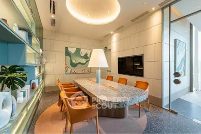 Modern study room with elegant decor and large table, ideal for meetings.