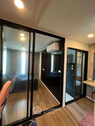 Modern apartment with glass partitions and stylish bedroom design