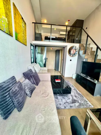Modern duplex living room with stylish decor and mezzanine bedroom