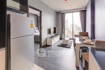 Modern open-plan living room with city view, sleek kitchen, and cozy dining area in a high-rise apartment.