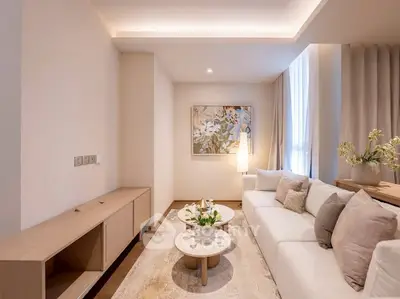 Elegant living room with modern decor and cozy seating area, perfect for relaxation.