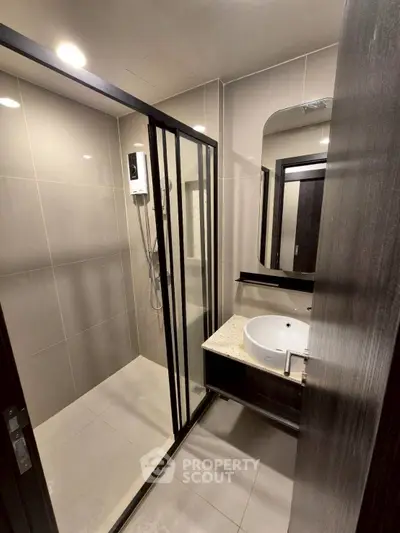 Modern bathroom with sleek shower enclosure and stylish vanity