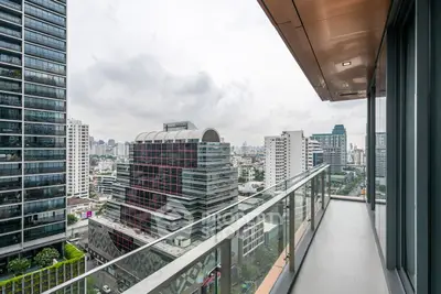 Stunning cityscape view from a modern high-rise balcony, perfect for urban living enthusiasts.