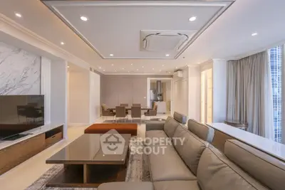 Luxurious modern living room with elegant furniture and open dining area