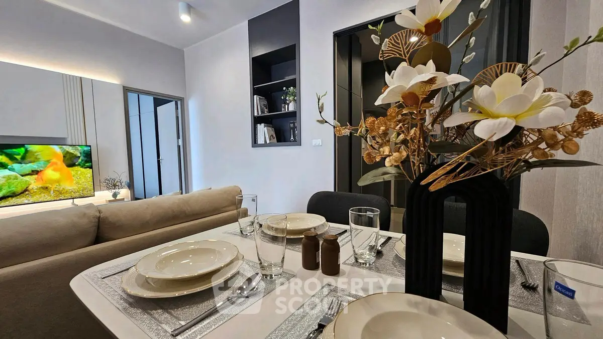 Modern living room with elegant dining setup and stylish decor