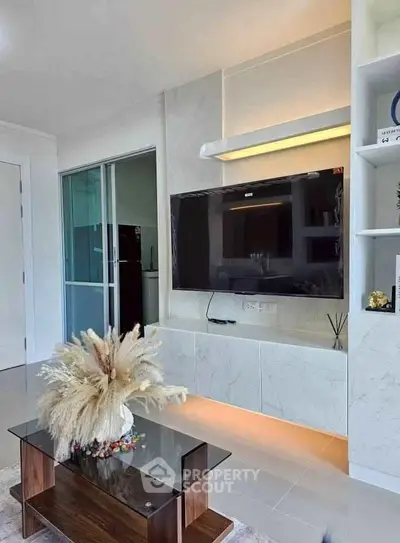 Modern living room with sleek TV setup and elegant decor