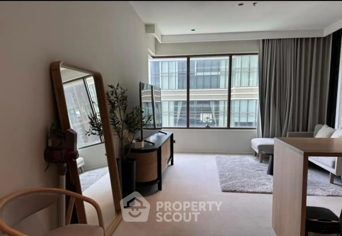 Modern living room with large window and stylish decor