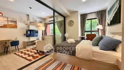 Modern studio apartment with open layout, stylish decor, and natural light.