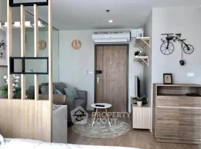 Modern living room with stylish decor and air conditioning in a cozy apartment.