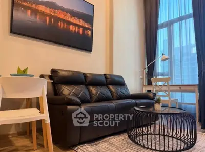 Modern living room with leather sofa and stylish decor