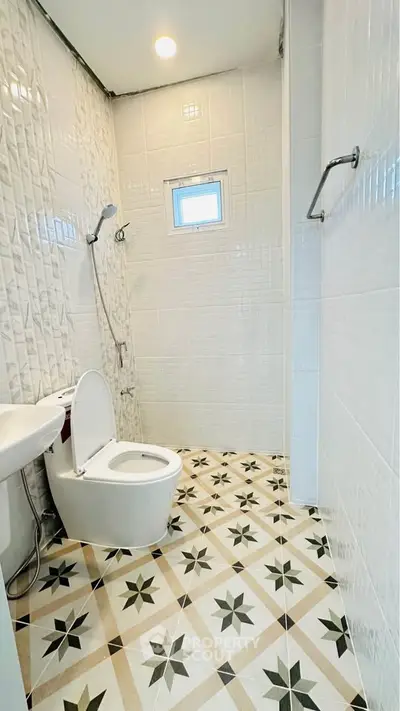 Modern bathroom with stylish tile flooring and sleek fixtures
