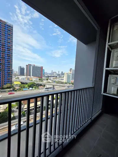 Stunning city view from a modern balcony in a high-rise apartment, perfect for urban living.