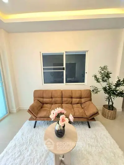 Stylish living room with cozy sofa and elegant decor in modern apartment.