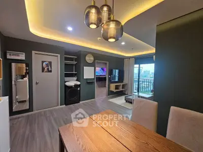 Modern living room with stylish lighting and balcony view in a contemporary apartment.