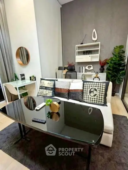 Modern living room with stylish decor and cozy seating area, perfect for relaxation and entertainment.