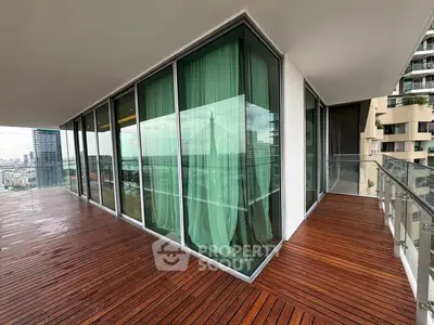 Luxurious corner unit with expansive balcony and stunning city views, perfect for urban living.
