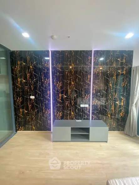Modern living room with stylish accent wall and sleek flooring