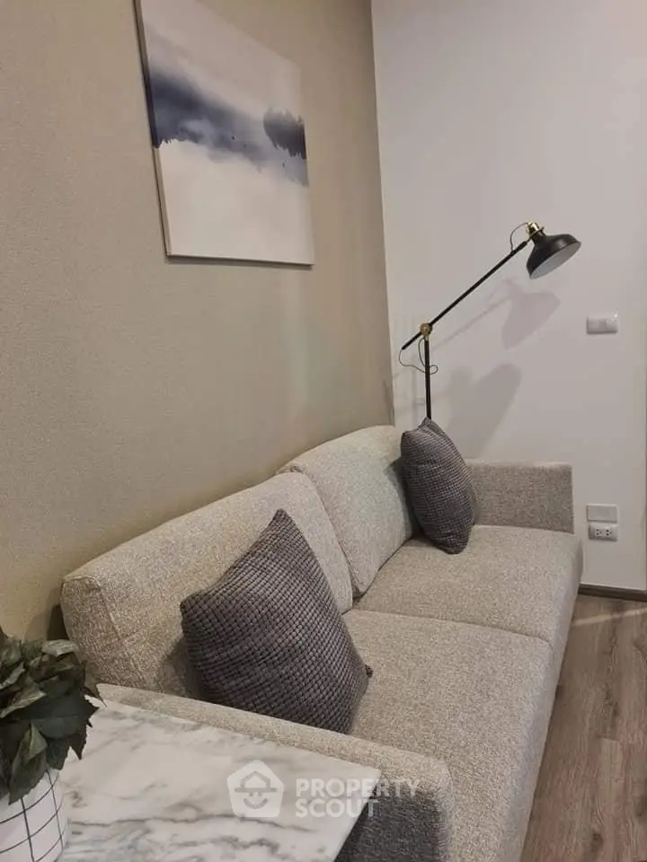 Cozy living room with modern sofa and stylish floor lamp