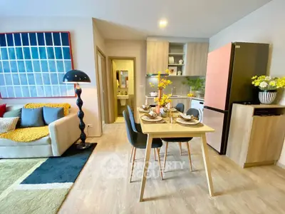 Modern open-plan living and dining area with stylish decor and contemporary furniture.