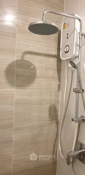 Modern bathroom with sleek showerhead and water heater