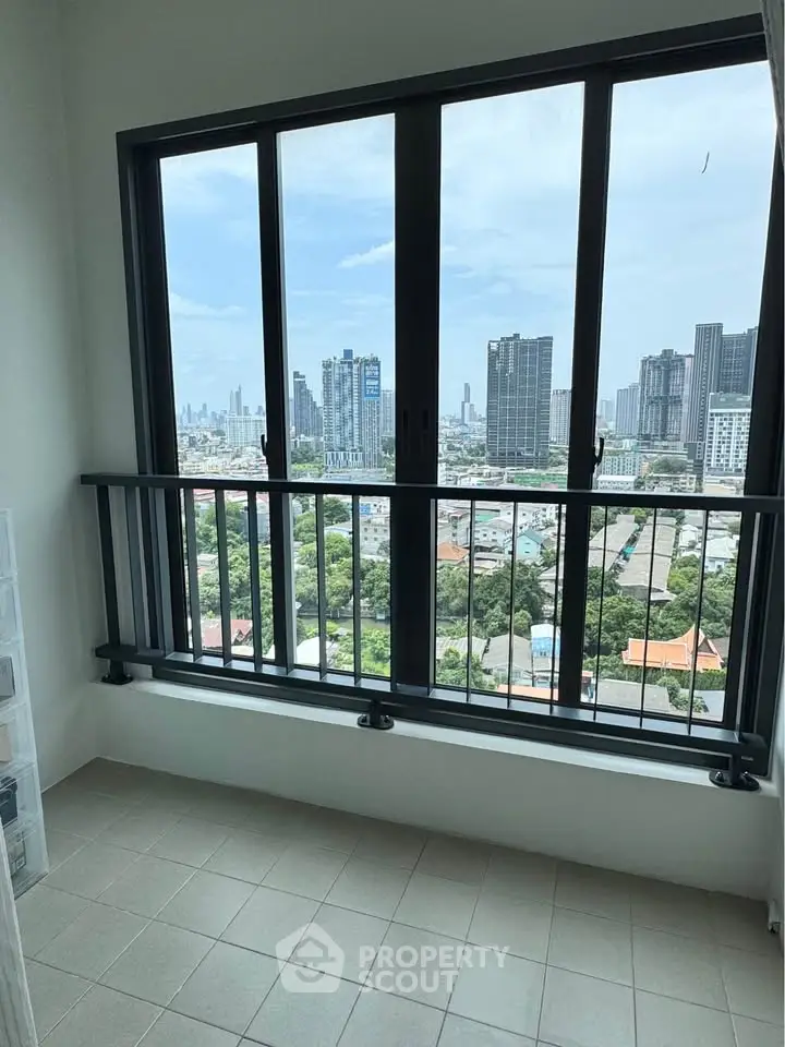 Stunning city view from modern apartment balcony with sleek railing design.