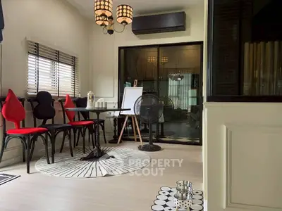 Stylish modern living room with unique chairs and elegant decor, perfect for cozy gatherings.