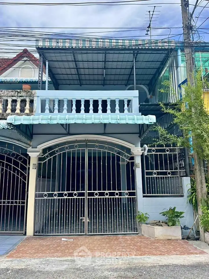 Charming townhouse with gated entrance and covered parking in a quiet neighborhood.