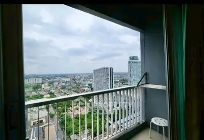 Stunning high-rise balcony with panoramic city views, perfect for urban living.