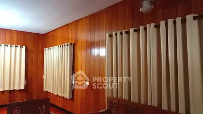 Cozy wooden living room with elegant curtains and classic furniture