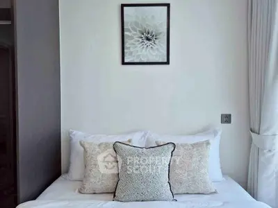 Elegant bedroom with stylish decor and cozy pillows, perfect for relaxation.