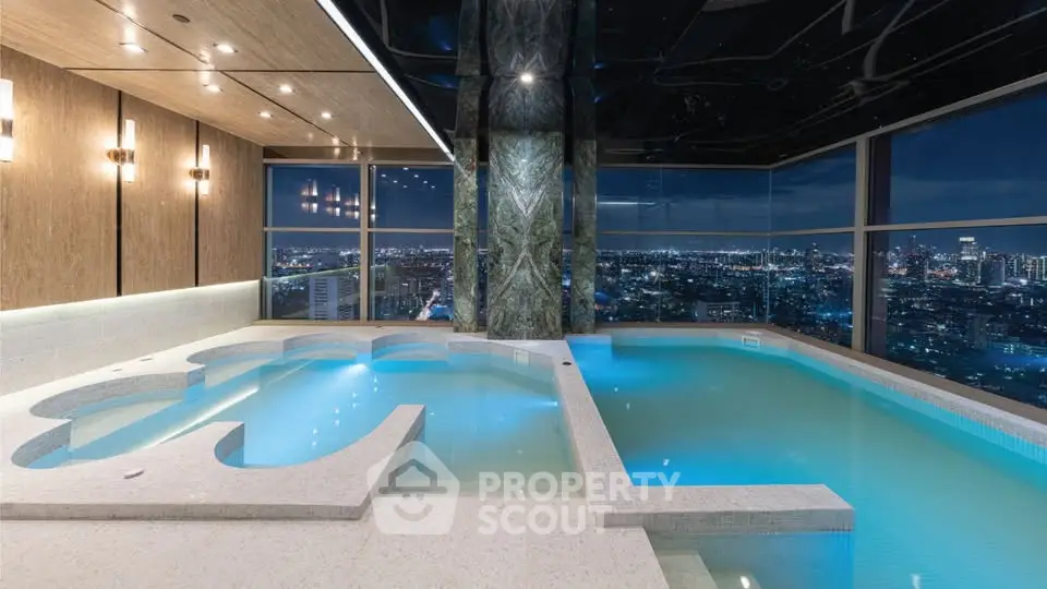 Luxurious rooftop pool with stunning city skyline view at night