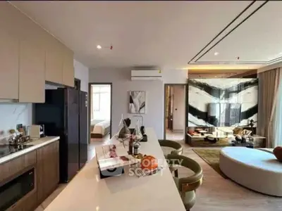 Luxurious open-plan living room and kitchen with modern decor and stylish furnishings.