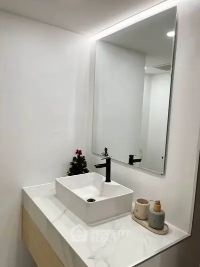 Modern bathroom with sleek sink and minimalist decor