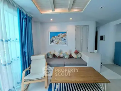 Charming living room with cozy seating and modern decor, featuring a stylish wooden coffee table and vibrant cushions.