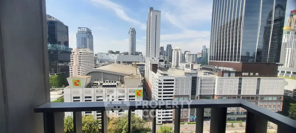 Stunning cityscape view from a modern balcony in a high-rise building.