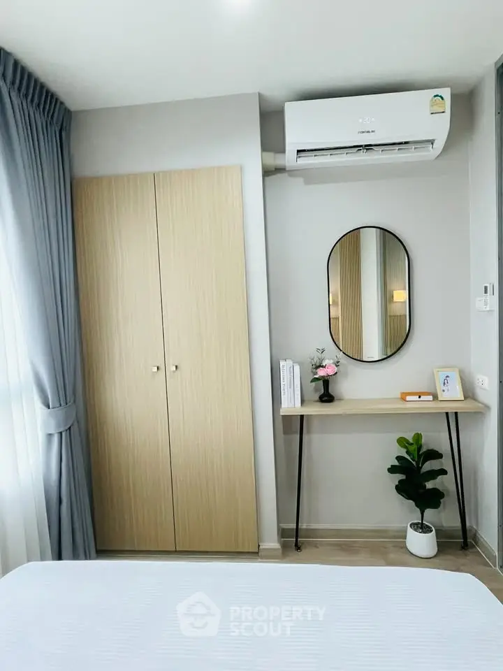 Modern bedroom with air conditioning and stylish decor
