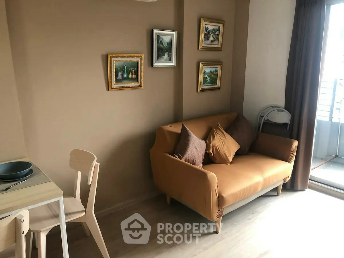 Cozy living room with stylish decor and natural light, perfect for relaxation and entertaining.
