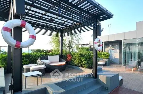 Luxurious rooftop terrace with modern seating and lush greenery