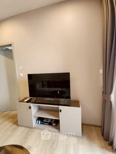 Modern living room with sleek TV stand and neutral decor