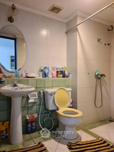 Spacious bathroom with modern fixtures and ample storage space