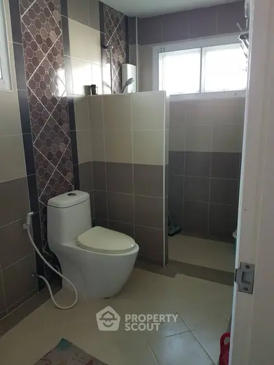 Modern bathroom with stylish tiles and natural light