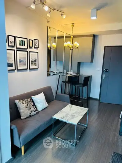 Modern living room with stylish decor and cozy seating area in a contemporary apartment.