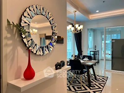 Stylish modern dining area with elegant decor and contemporary lighting in a luxurious apartment.