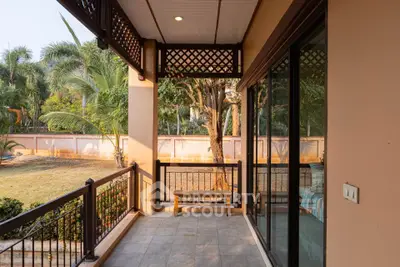 Charming balcony with garden view, perfect for relaxation and enjoying nature's tranquility.
